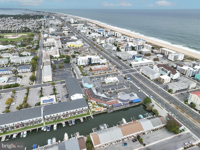 bird's eye view featuring a beach view and a water view