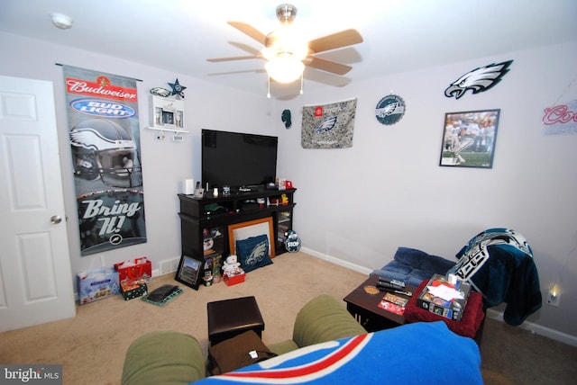 recreation room featuring carpet and ceiling fan