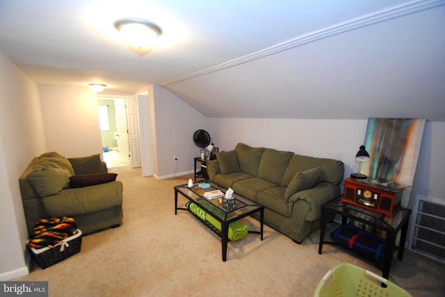 carpeted living room featuring vaulted ceiling