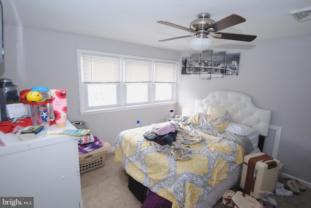 bedroom featuring ceiling fan and light carpet