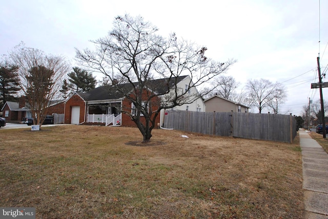 view of yard featuring covered porch