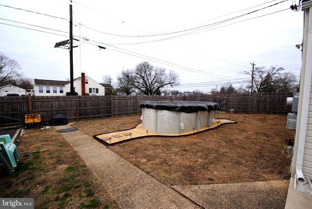 view of yard featuring a covered pool