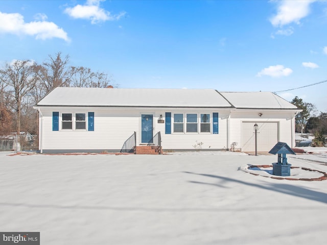 ranch-style home featuring a garage