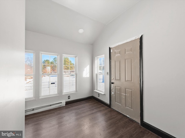 entrance foyer with a baseboard heating unit, vaulted ceiling, and dark wood-type flooring