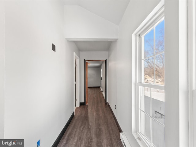 hall with lofted ceiling, dark wood-type flooring, and a baseboard radiator