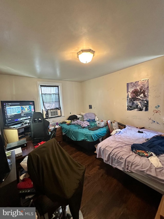 bedroom with hardwood / wood-style flooring