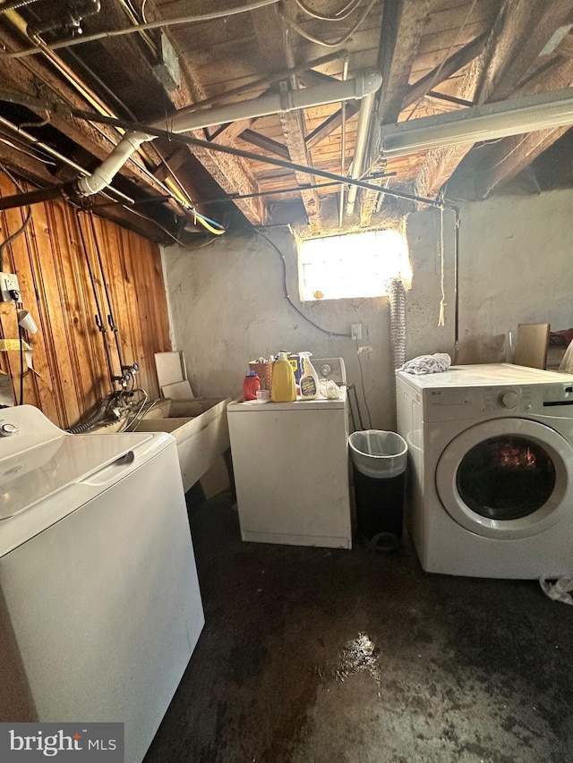 laundry area with washer and dryer and sink