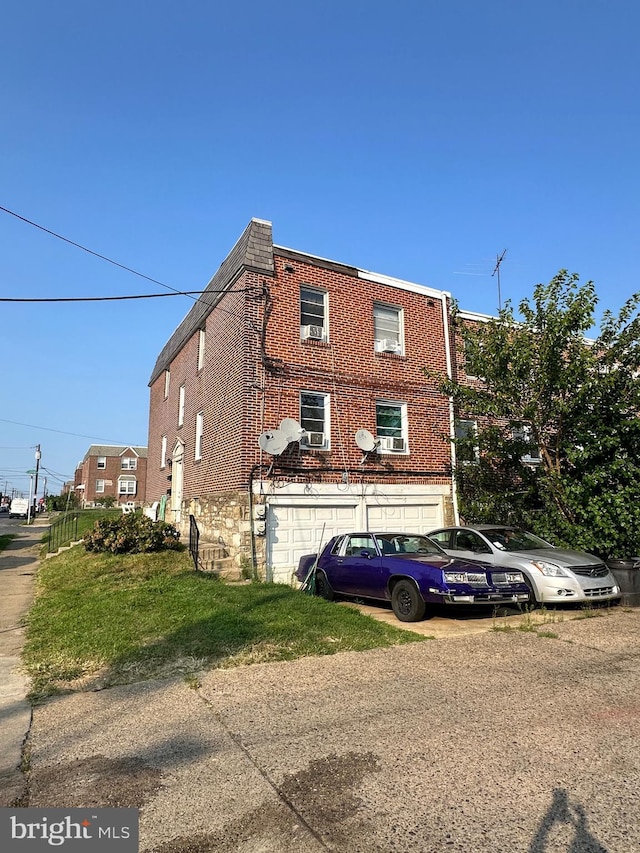 view of side of property with a garage