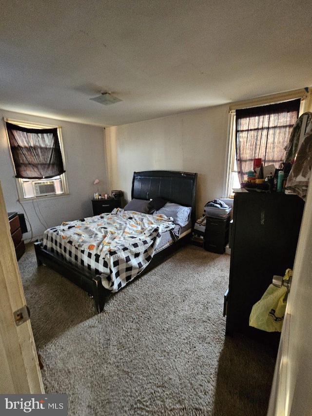 carpeted bedroom featuring cooling unit