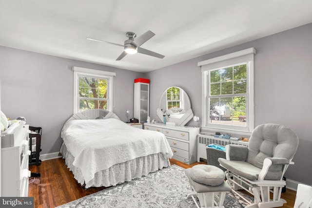 bedroom with dark wood-type flooring and ceiling fan