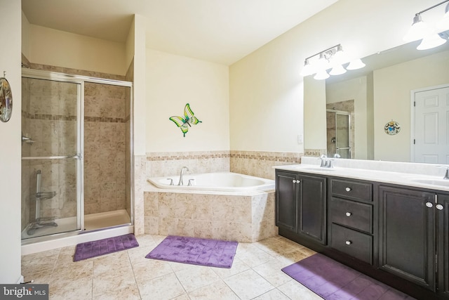 bathroom featuring vanity, tile patterned floors, and separate shower and tub