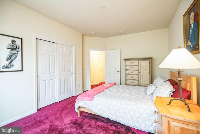 carpeted bedroom featuring a closet