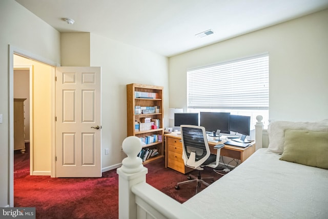 home office with dark colored carpet