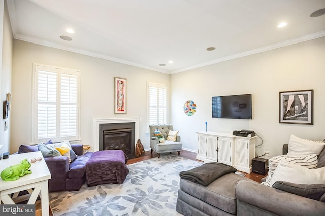 living room featuring hardwood / wood-style flooring and ornamental molding