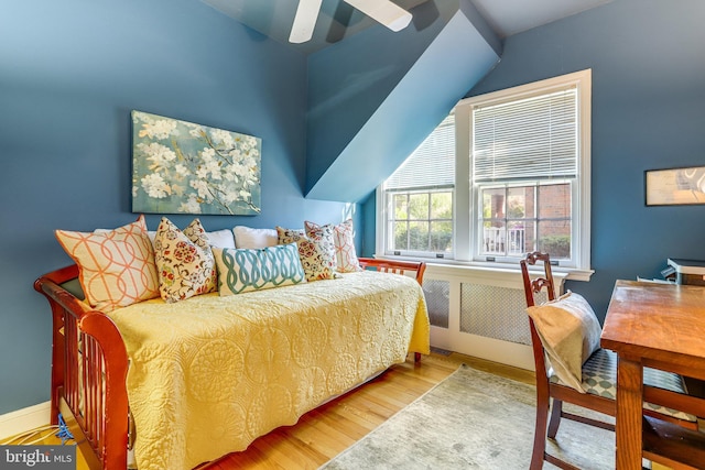 bedroom featuring wood-type flooring and ceiling fan