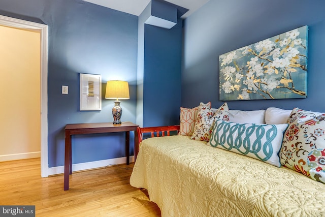 bedroom with hardwood / wood-style flooring