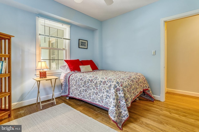 bedroom featuring wood-type flooring and ceiling fan