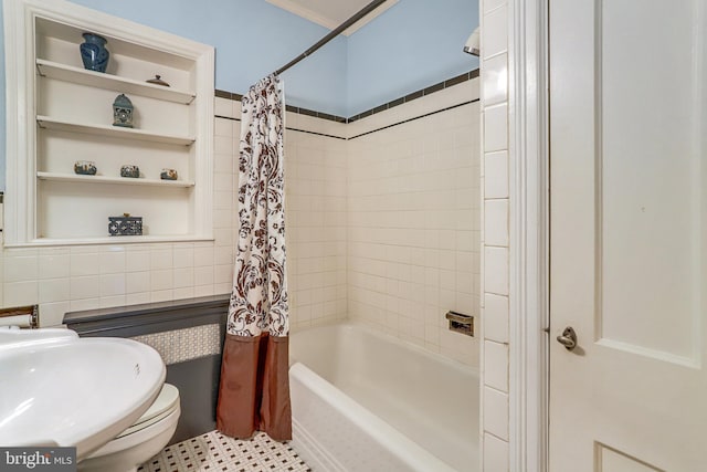 bathroom featuring tile walls and shower / bath combo