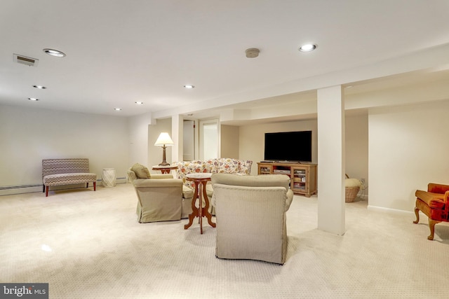 carpeted living room featuring a baseboard heating unit