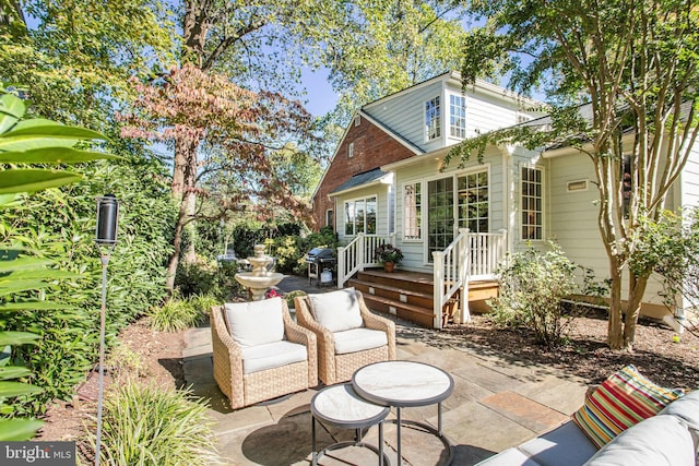 view of patio featuring area for grilling and an outdoor living space