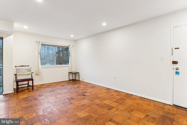 spare room with parquet floors