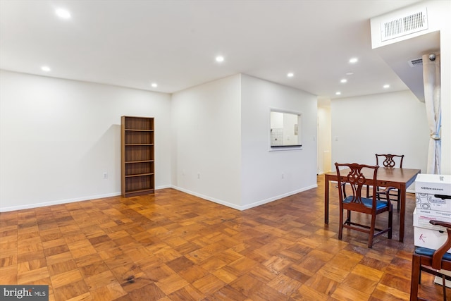 dining space with parquet floors