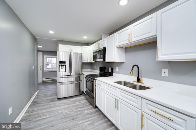 kitchen featuring white cabinetry, sink, and appliances with stainless steel finishes