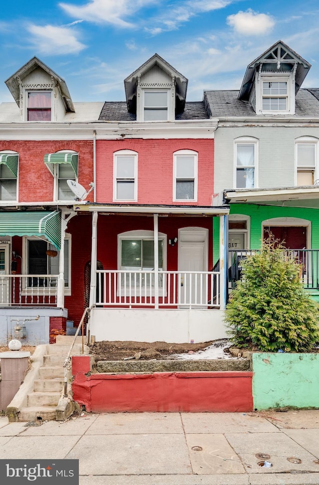 townhome / multi-family property with covered porch