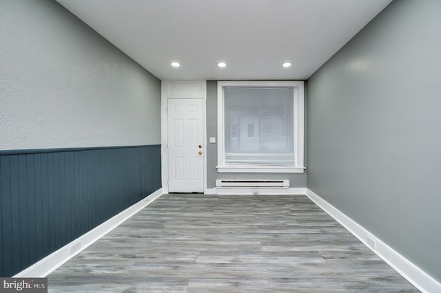 interior space featuring a baseboard heating unit