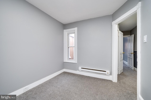 unfurnished room with carpet and a baseboard radiator