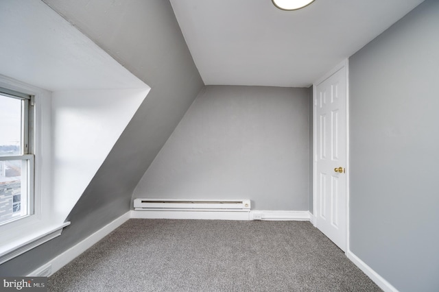 additional living space featuring carpet flooring and a baseboard radiator