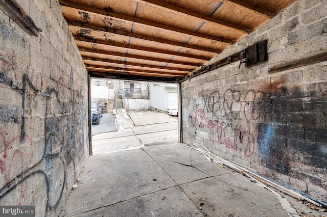 corridor with concrete flooring