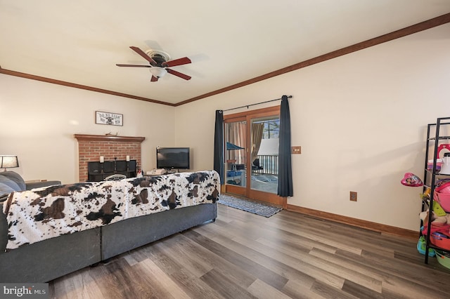 bedroom featuring crown molding, hardwood / wood-style flooring, access to exterior, and ceiling fan