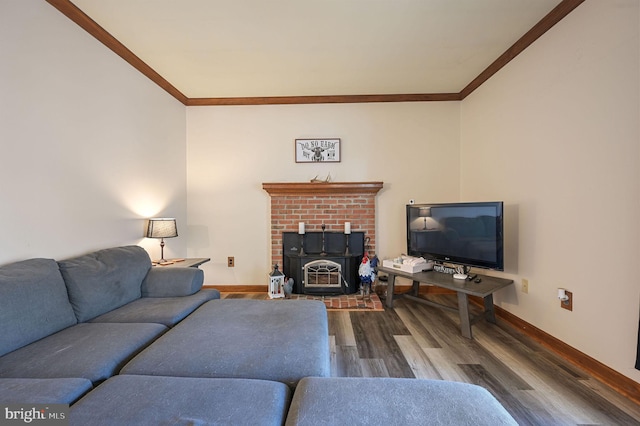 living room with hardwood / wood-style flooring, a wood stove, and ornamental molding