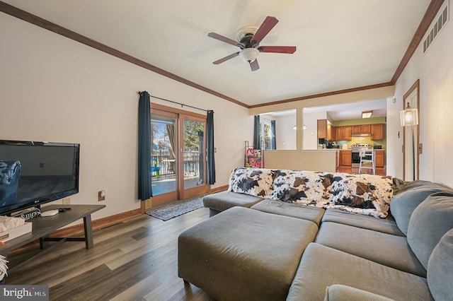 living room with crown molding, ceiling fan, and dark hardwood / wood-style flooring