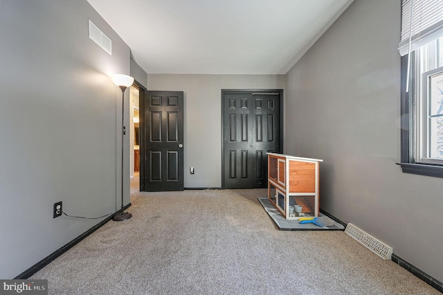 interior space with light colored carpet