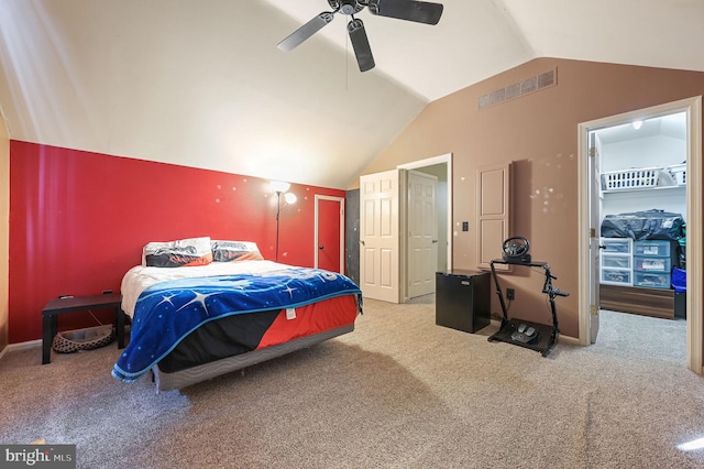 bedroom featuring light carpet, vaulted ceiling, and ceiling fan