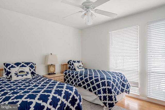 bedroom featuring ceiling fan and light hardwood / wood-style flooring