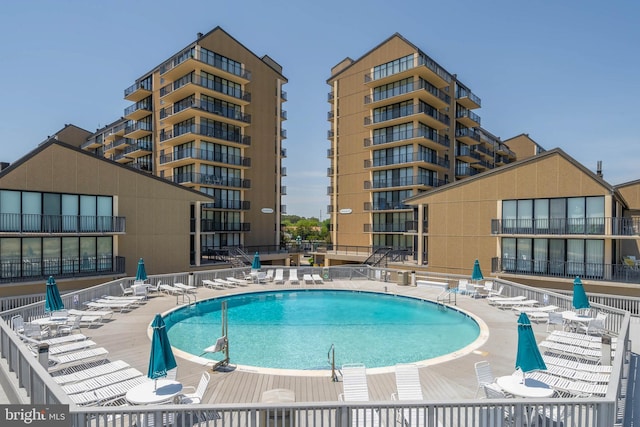 view of swimming pool with a patio