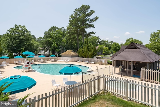 view of pool with a patio area and a gazebo