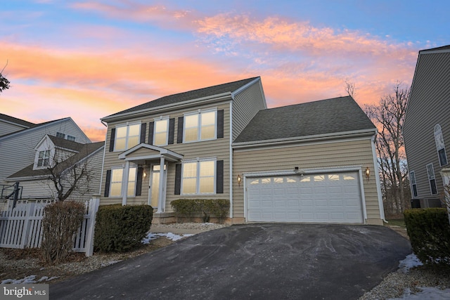 view of front of property with a garage