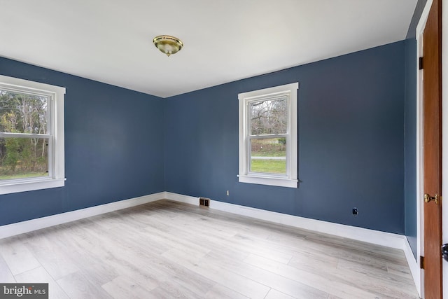 empty room with light wood-type flooring