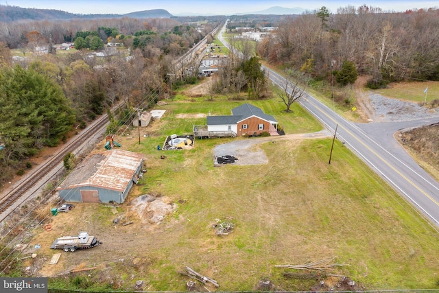 birds eye view of property featuring a mountain view