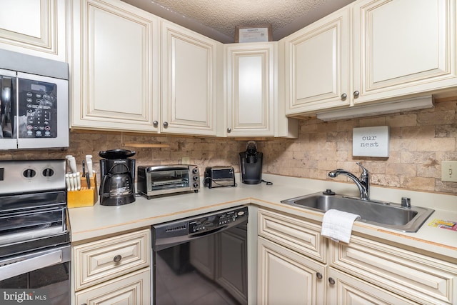 kitchen with dishwasher, sink, tasteful backsplash, cream cabinets, and electric stove