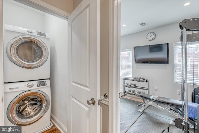 washroom with stacked washer and clothes dryer