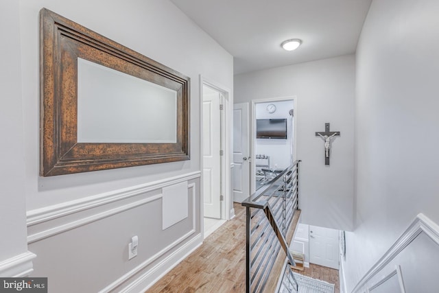 hall with light hardwood / wood-style flooring