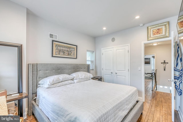 bedroom featuring light hardwood / wood-style floors and a closet