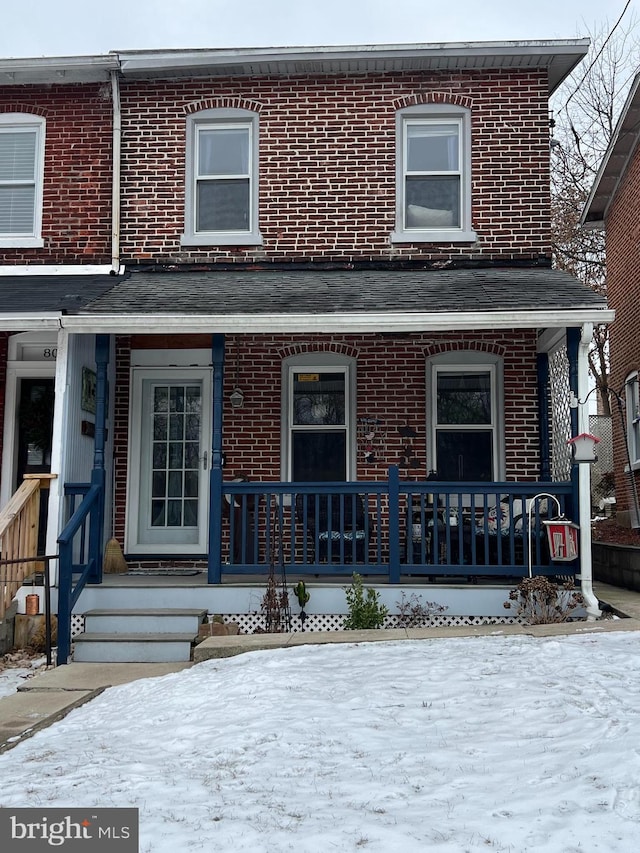 townhome / multi-family property with covered porch