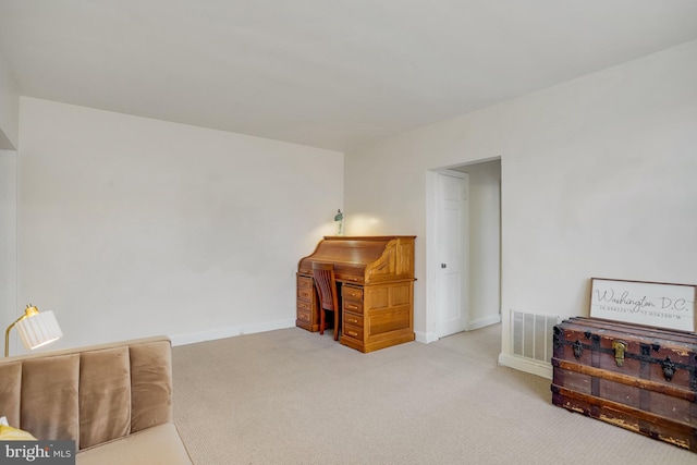 sitting room with carpet flooring