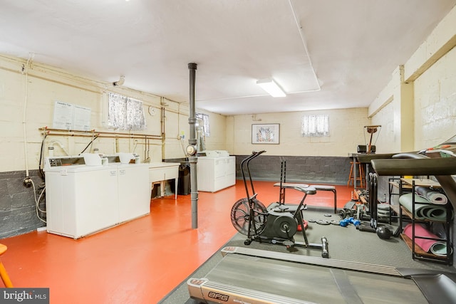 workout area with independent washer and dryer